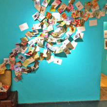 A fun installation covers one wall. It’s a suitcase with wizarding world pamphlets flying out of it.