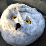 A “Harry Potter” bean bag made to look like a snowy owl, including yellow eyes and a beak