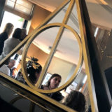 A mirror in the shape of the Deathly Hallows symbol