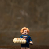 Queenie’s LEGO minifigure includes a LEGO strudel… we wish we could eat it. (LEGO minifigures and all their parts not advised for children under 5.)