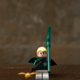 Draco’s LEGO minifigure is dressed in his Quidditch uniform and a matching green broomstick – all of which his father bought him, of course.