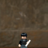 Credence’s LEGO minifigure includes one of his stepmother’s flyers (ugh, the heartache).