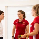 Emma Watson talks to England Hockey players Helen Richardson-Walsh and Emily Defroand.