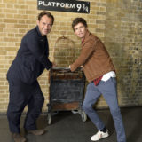 Law and Redmayne pose with a trolley at King’s Cross Platform 9 3/4