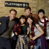 Law and Redmayne pose with the same group of Gryffindors for an official photo.