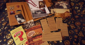 John Winchester’s replica hunting journal, medals, photos, newspaper clippings, and rosary