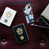 Harry Potter Magic Photo and Video Printer in both black and white alongside two printed photos