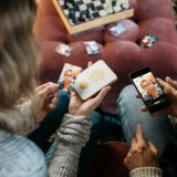 Harry Potter Magic Photo and Video Printer in use by two Muggles, showing a photo having been sent from a cell phone to the printer