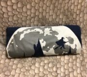 This month’s T-shirt features a silhouette of a figure on a broomstick in the moonlight.