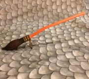 This broomstick figurine is a perfect addition to any desk or bookshelf.