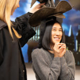 Eva Chen is excitedly waiting to hear which Hogwarts House the Sorting Hat is about to put her in.