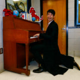 Ezra Miller from “Fantastic Beasts: The Crimes of Grindelwald” plays the piano as he helps celebrate Wizarding World Day at Parkside Middle School in Baileyton, AL.  (Photo by Butch Dill/Getty Images)