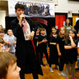 Ezra Miller from “Fantastic Beasts: The Crimes of Grindelwald” celebrates Wizarding World Day at Parkside Middle School in Baileyton, AL.  (Photo by Butch Dill/Getty Images)