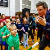 Eddie Redmayne from “Fantastic Beasts: The Crimes of Grindelwald” talks to students to help celebrate Wizarding World Day at Parkside Middle School in Baileyton, AL.  (Photo by Butch Dill/Getty Images)