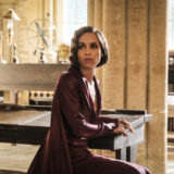Leta Lestrange sits at a desk.