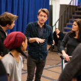 James Snyder talks with his new “family.”