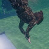 Credence’s aunt dives for the baby before special effects have been added.