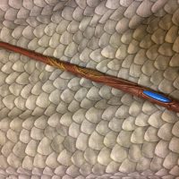 This box included a wand featuring a feather design and blue stone detail.