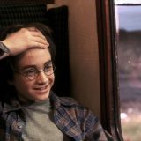 Harry reveals his lightning-bolt scar.