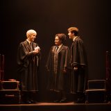 Scorpius Malfoy (William McKenna), Rose Granger-Weasley (Manali Datar), and Albus Potter (Sean Rees-Wemyss) converse aboard the Hogwarts Express.