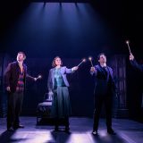 Hermione Granger (Paula Arundell), Ron Weasley (Gyton Grantley), Ginny Potter (Lucy Goleby), Harry Potter (Gareth Reeves), and Draco Malfoy (Tom Wren) hold their wands aloft.