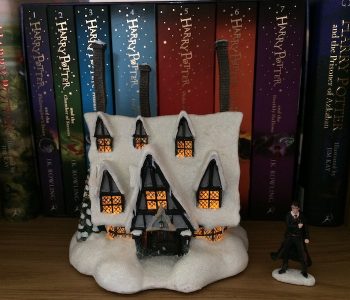 Dim the lights, add some batteries, and flip the switch on the back of the “THREE BROOMSTICKS PUB™”, and the magic of this collector’s item is revealed.