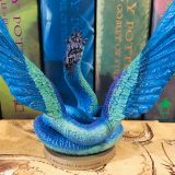 From the back, the Occamy’s blue wings are so detailed that one can see the individual feathers.