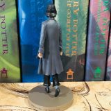 The detailed pleating in Tina’s coat is visible from behind as well.