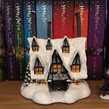 When illuminated, the windows of the “THREE BROOMSTICKS PUB™” look so cozy and inviting!