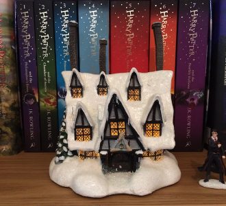 When illuminated, the windows of the “THREE BROOMSTICKS PUB™” look so cozy and inviting!