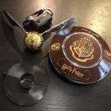 Full GOLDEN SNITCH™ set, including AC adapter, illuminated base, GOLDEN SNITCH™, and a launcher