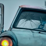 The Cornish Pixie is hanging on to the steering wheel.