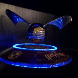 Harry Potter GOLDEN SNITCH™ on base, lit up