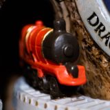 “HOGWARTS™ Express” train close-up as it leaves the tunnel on the front of the “HOGWARTS™ Express” Glitter Globe