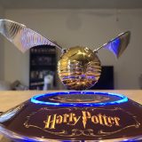 The GOLDEN SNITCH™ levitating above the illuminated base