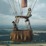 Eddie Redmayne and Felicity Jones go up, up and away in this still from “The Aeronauts”.