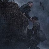 Eddie Redmayne battles to pull Felicity Jones back into the hot air balloon amidst a storm during this still from “The Aeronauts”.