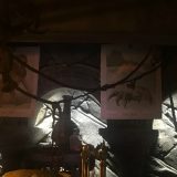 The Fire Crab and manticore illustrations are hung directly behind Hagrid’s work table, where they are easily accessible for research purposes.