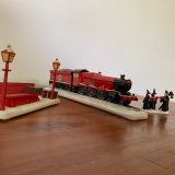 “HOGWARTS EXPRESS™”, Hogsmeade carolers, and train station bench