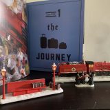 “HOGWARTS EXPRESS™”, Hogsmeade carolers, and train station bench with illustrated “Harry Potter” in the background