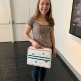 Sophia with Newt’s case at the “Here Be Dragons” scavenger hunt by fable & lark