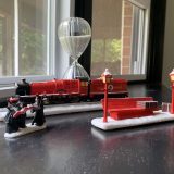 “HOGWARTS EXPRESS™”, Hogsmeade carolers, and train station bench