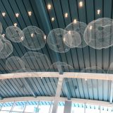 The lobby features decor on the ceiling reminiscent of sea foam.