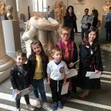 Kids with snake statue at fable & lark scavenger hunt