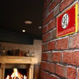 Enchantment Chamber brick accent wall detail with platform nine and three-quarters