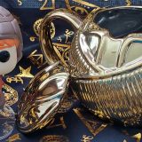 Ron Weasley Funko POP!, pictured with the Harry Potter Golden Snitch Coffee Mug from Hallmark Gold Crown, lid off