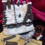 Contents of the package – “HOG’S HEAD INN™”, “HOGWARTS™” Sleigh, two chimneys, and certificate of authenticity