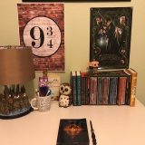 Harry Potter Hogwarts Lamp from The Bradford Exchange: pictured with other Harry Potter collectibles and books, Hogwarts castle base windows illuminated