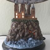Harry Potter Hogwarts Lamp Illuminated Base: right side view with the Hogwarts castle sculpture base illuminated