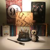 Harry Potter Hogwarts Lamp from The Bradford Exchange: pictured with other Harry Potter collectibles and books, Marauder’s Map lampshade illuminated